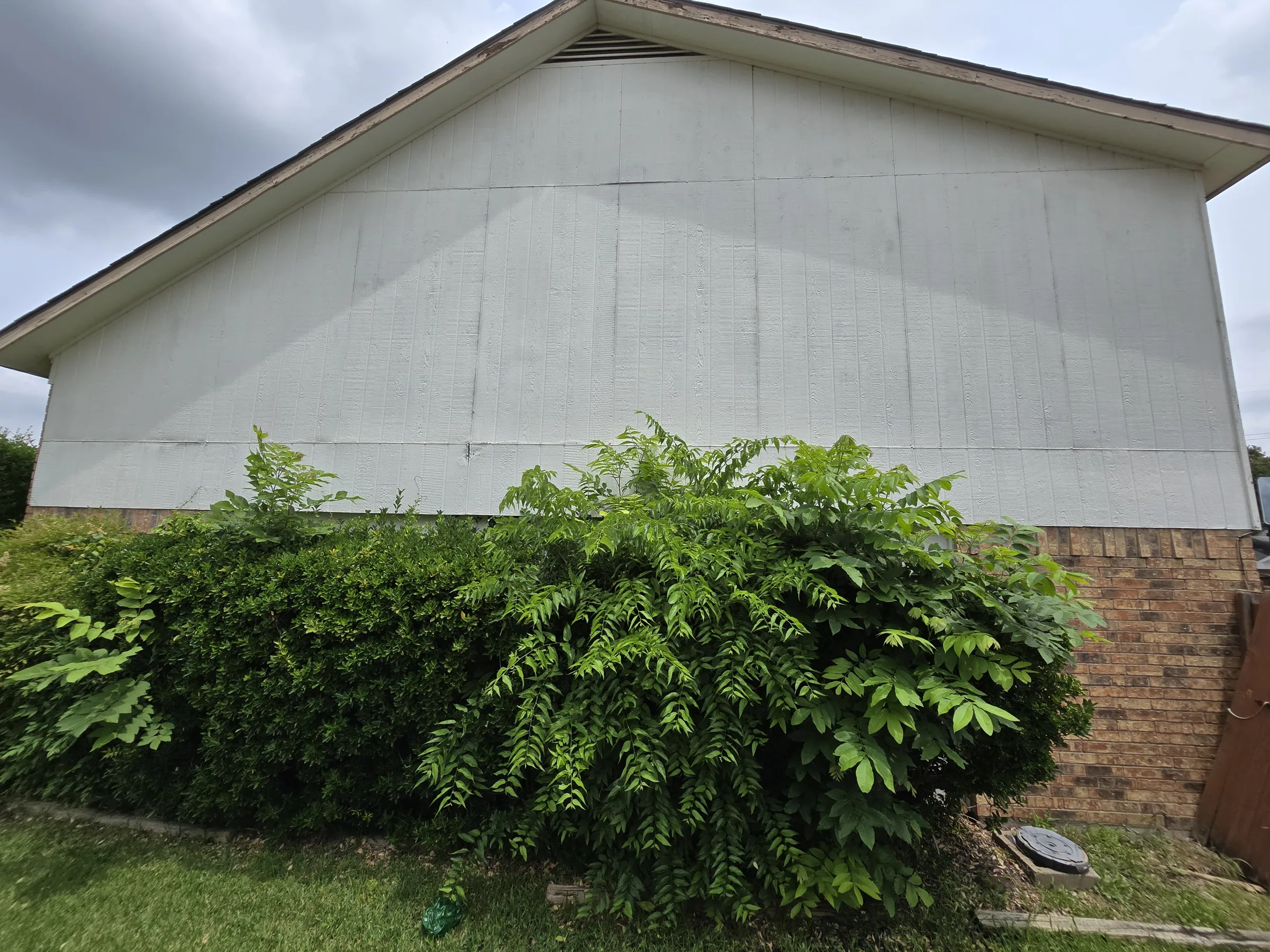 Exterior of a custom home from the driveway on an exterior remodel