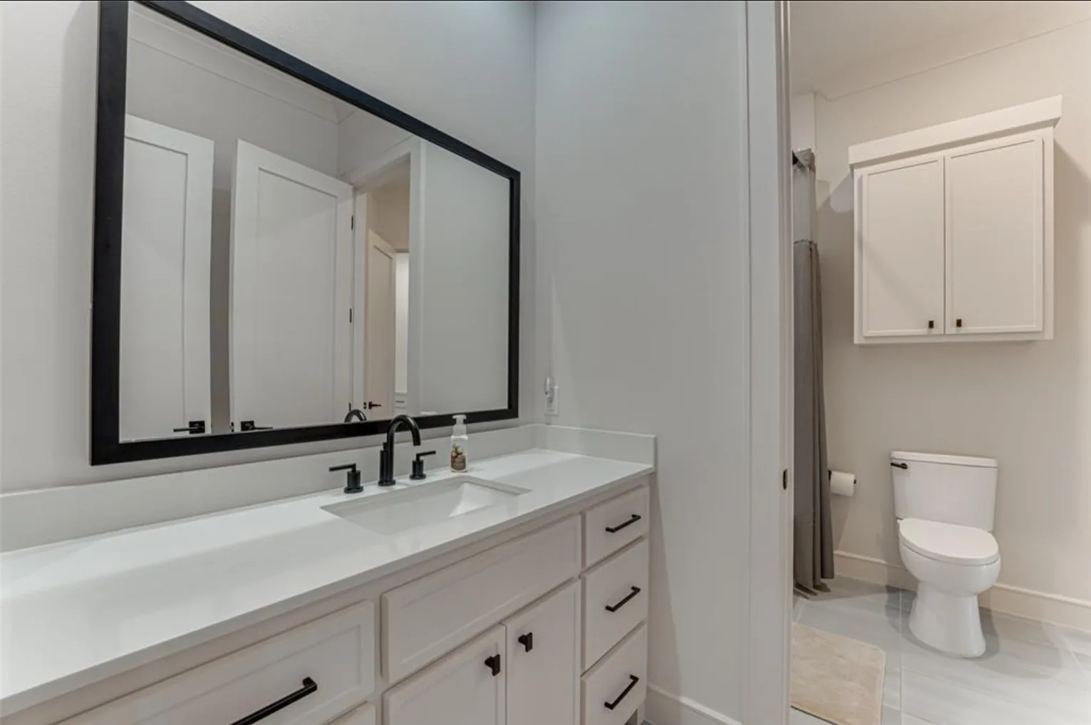 Interior of a custom home toward the adjoining room, mid-build at Fairways of Heath Crossing