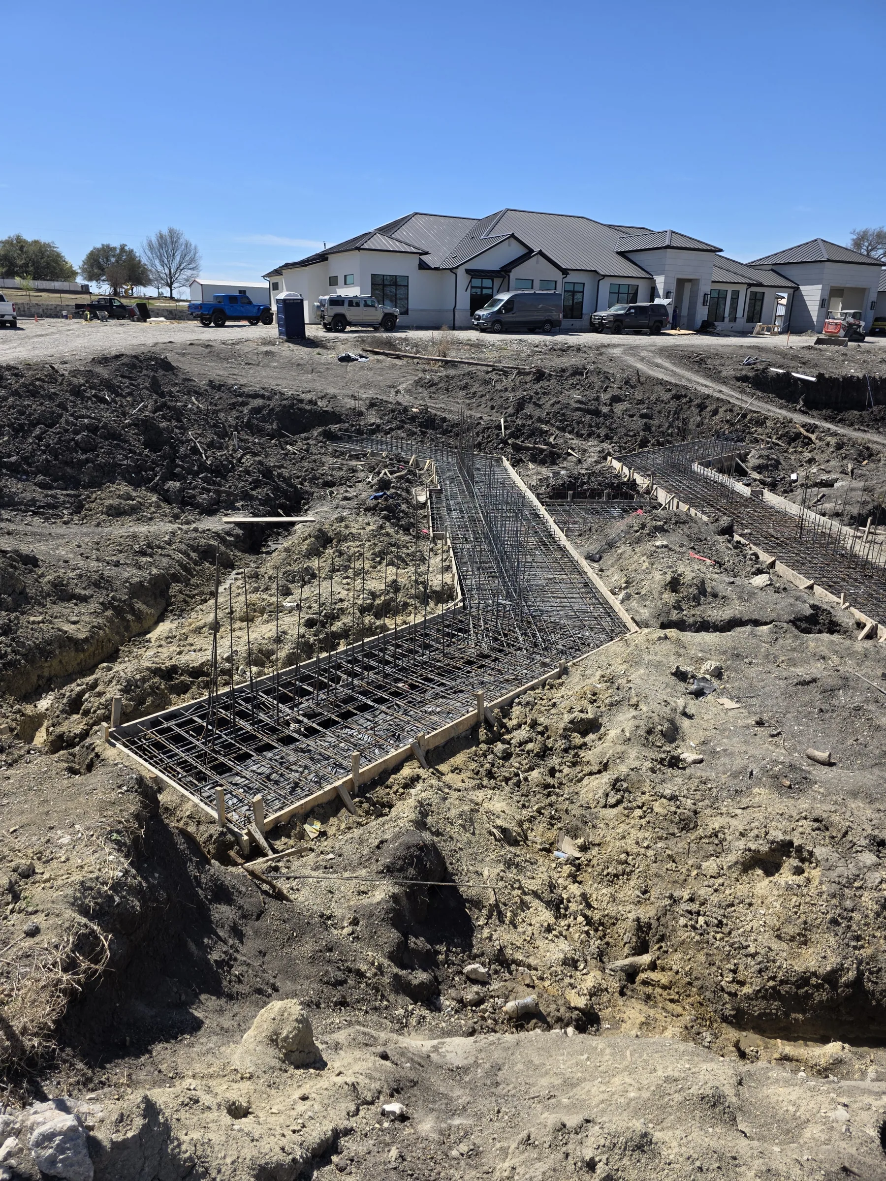 Foundation and site work across the pad during foundation work