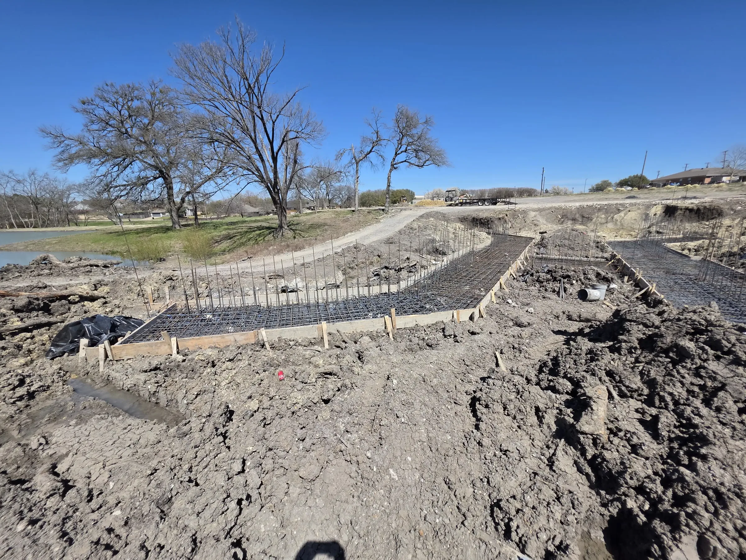 Foundation and site work before the pour, in daylight during foundation work