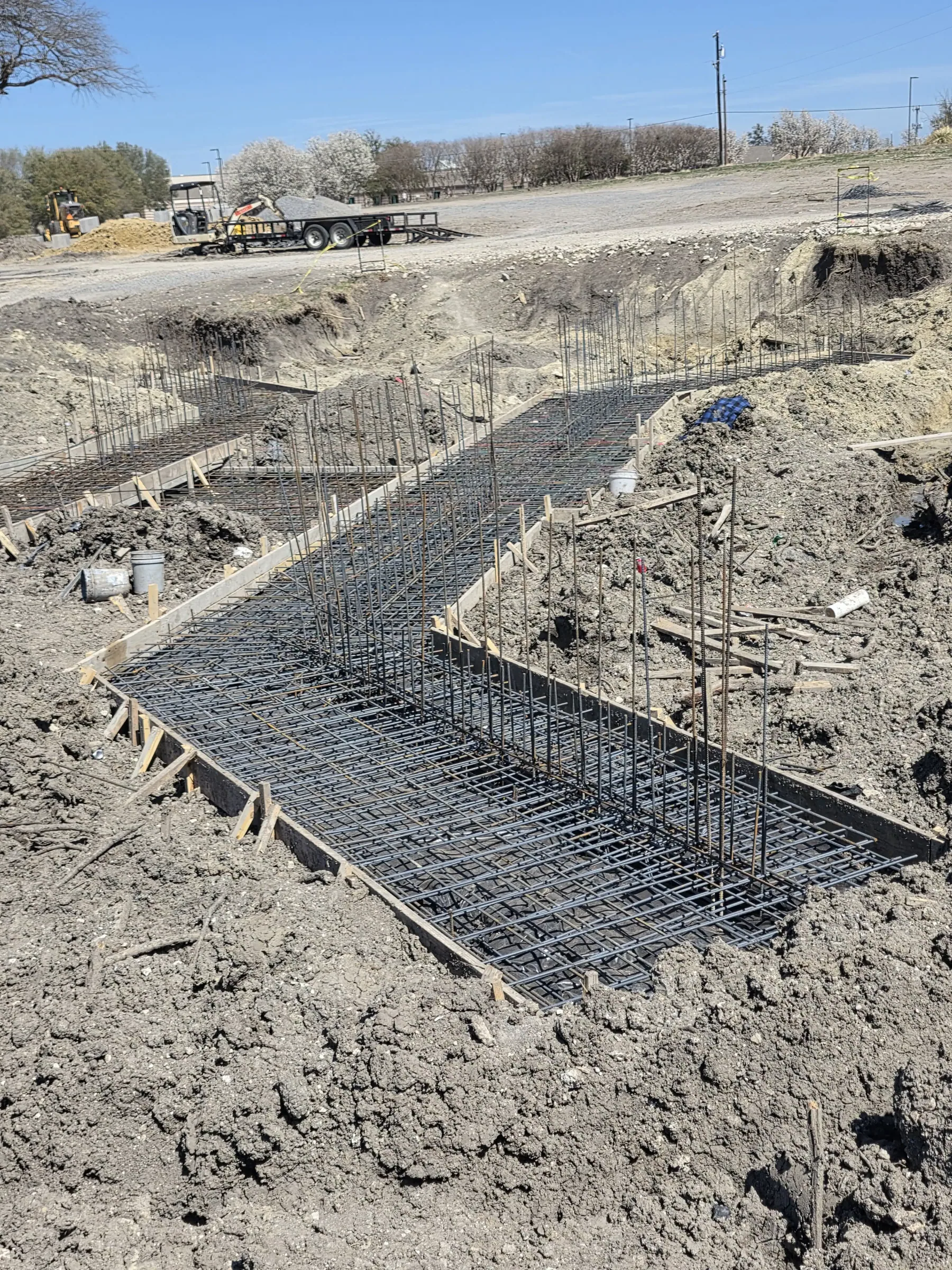 Foundation and site work at the footing line, in daylight during foundation work