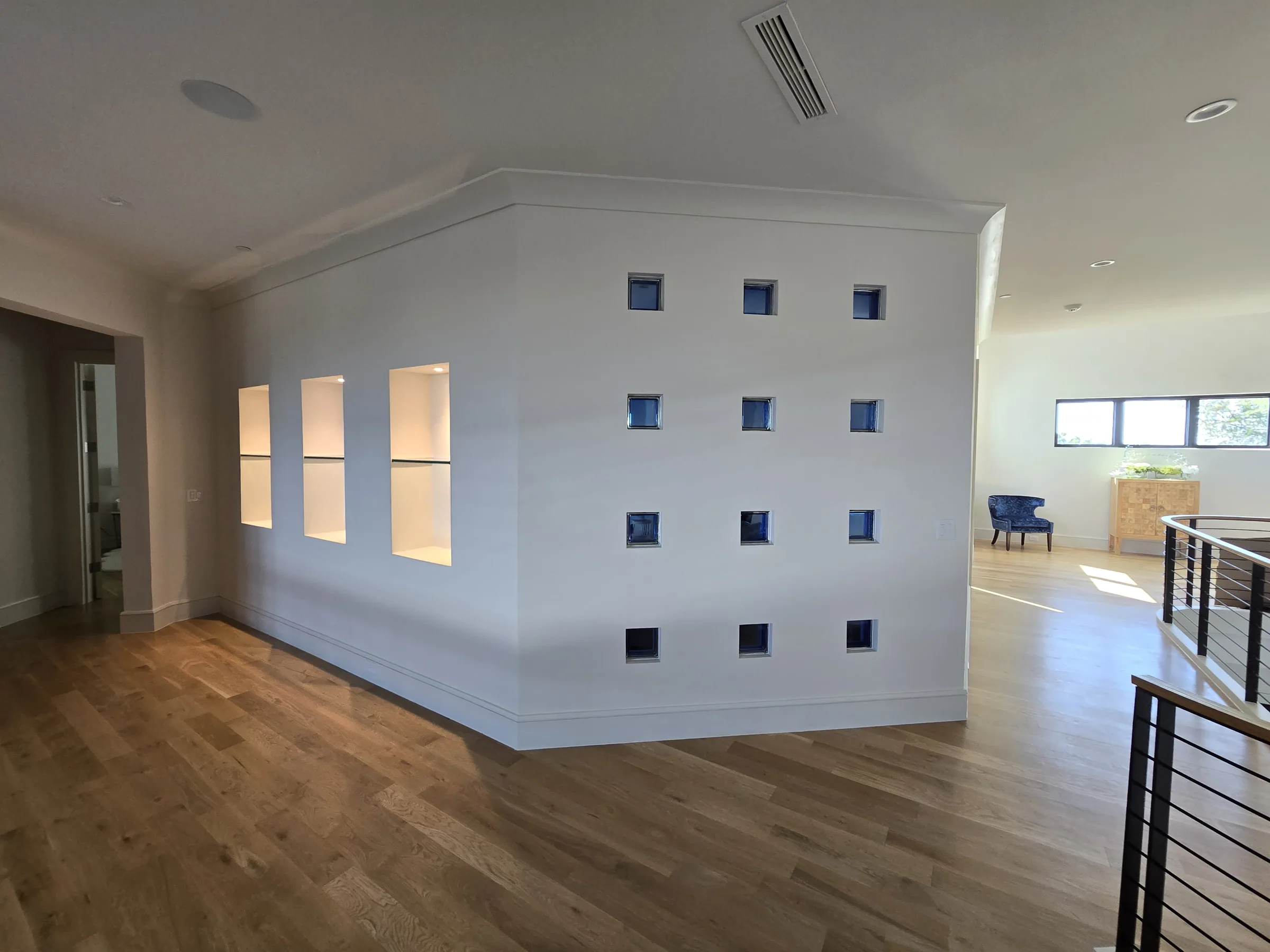 Interior of a custom home looking toward the windows, with the finishes in on private acreage in Heath