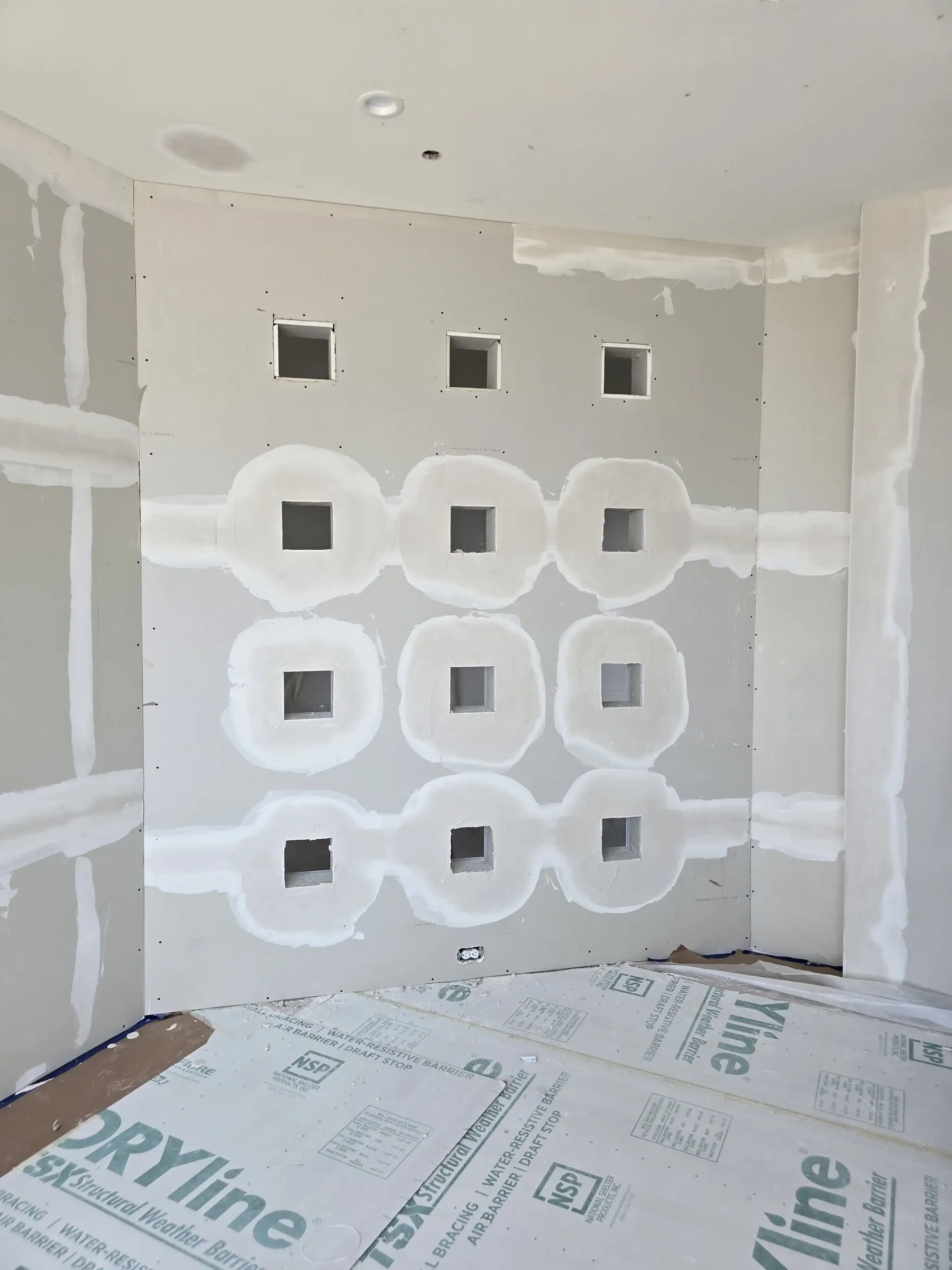 Interior of a custom home toward the ceiling detail, mid-build on private acreage in Heath