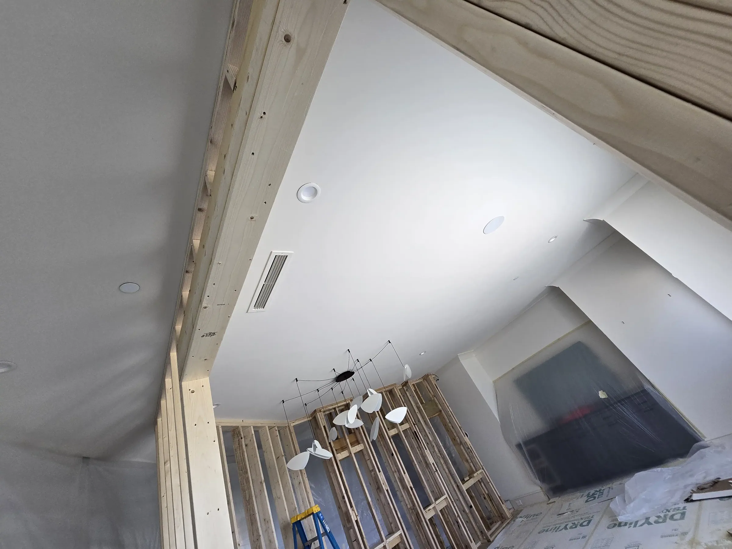 Interior of a custom home from the far corner, mid-build on private acreage in Heath