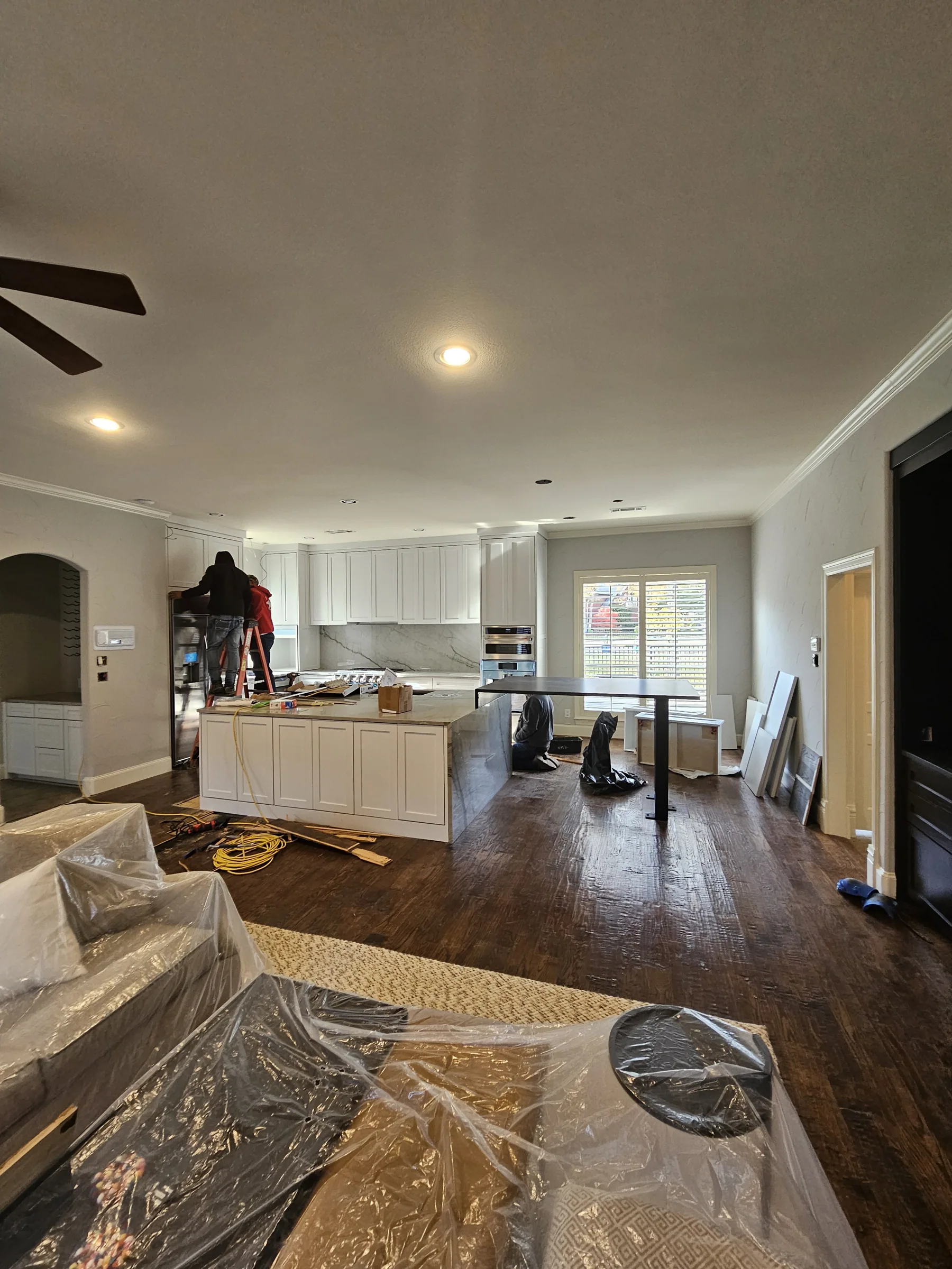 Interior of a custom home toward the adjoining room, in daylight on an interior remodel