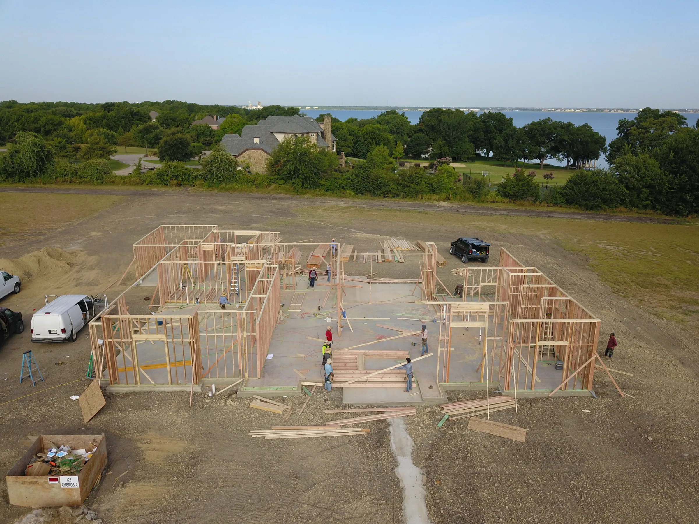 Aerial view of a custom home site across the lot on a job site