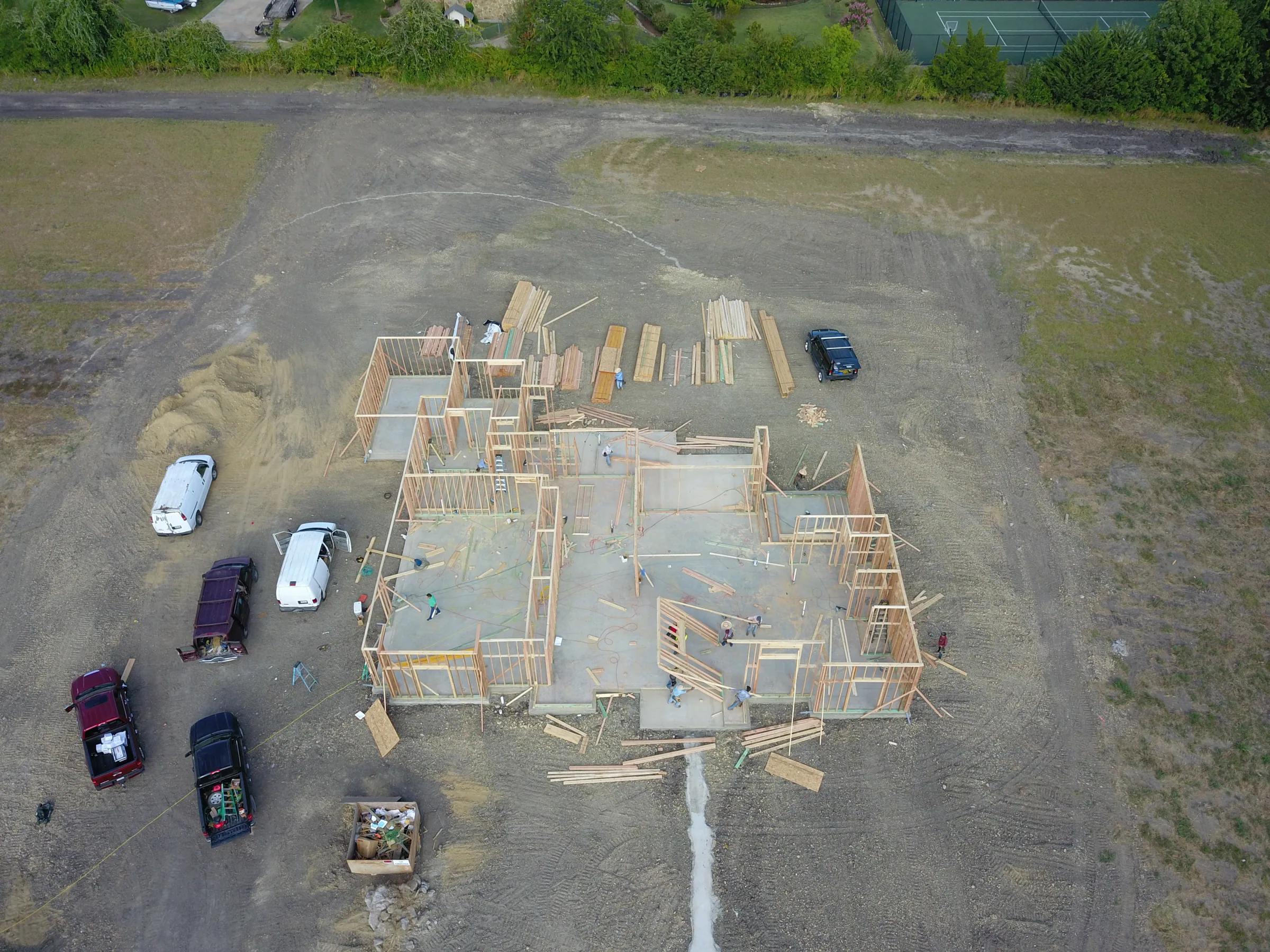 Aerial view of a custom home site from the rear of the property on a job site