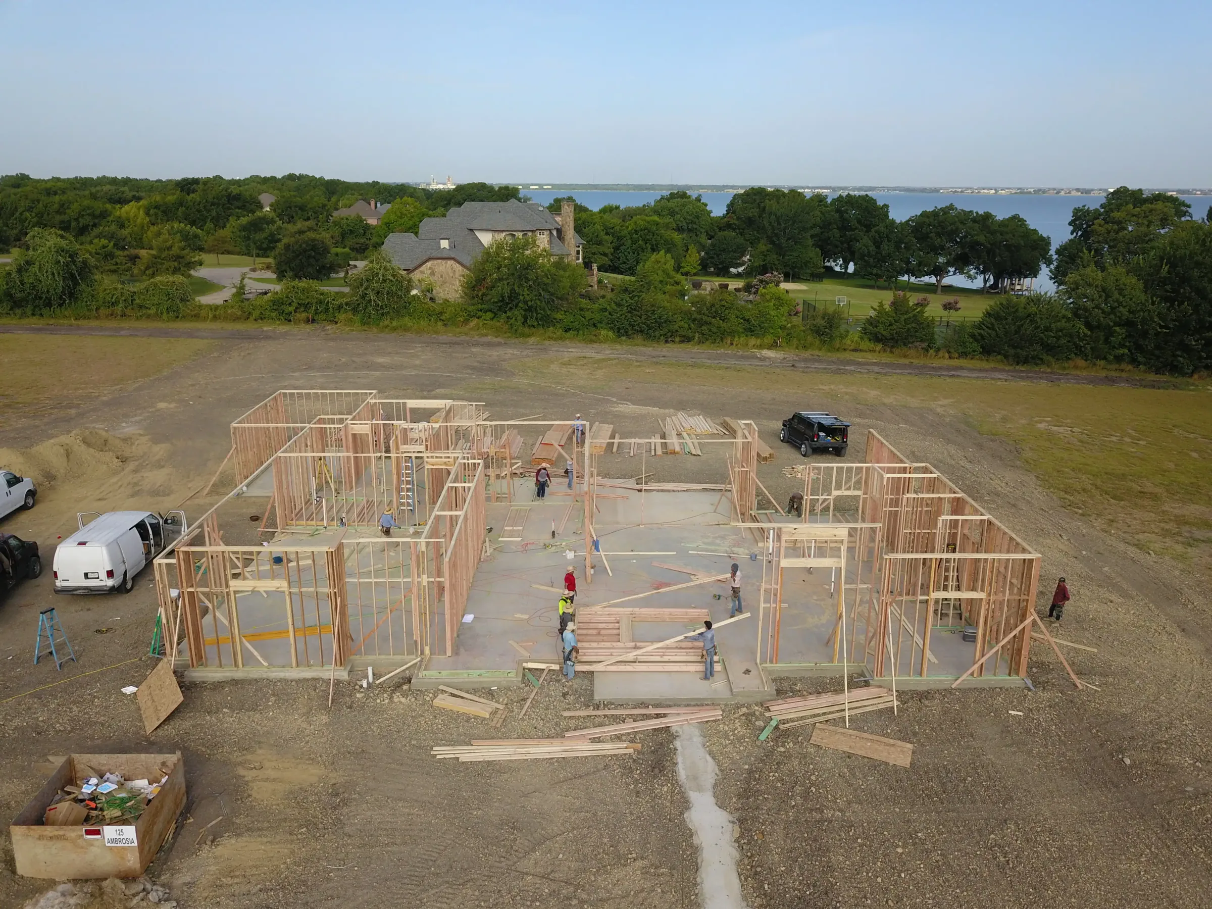 Aerial view of a custom home site from the rear of the property, with the finishes in on a job site