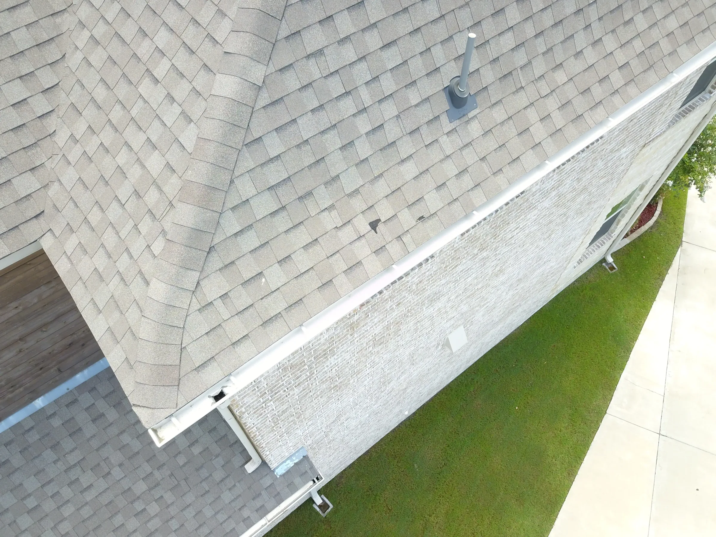Aerial view of a custom home site from above, mid-build on a job site