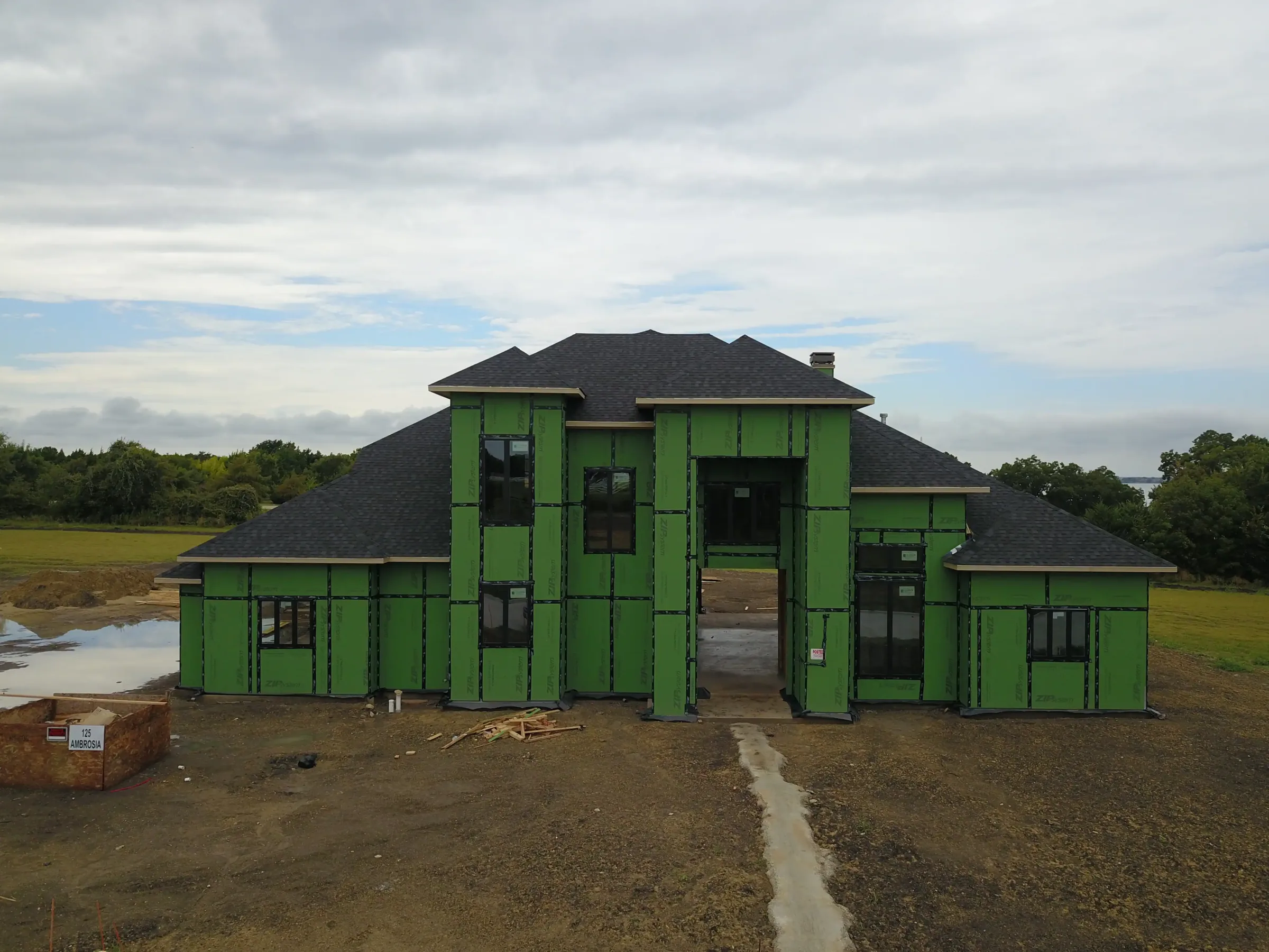 Aerial view of a custom home site from the rear of the property, from a second position on a job site