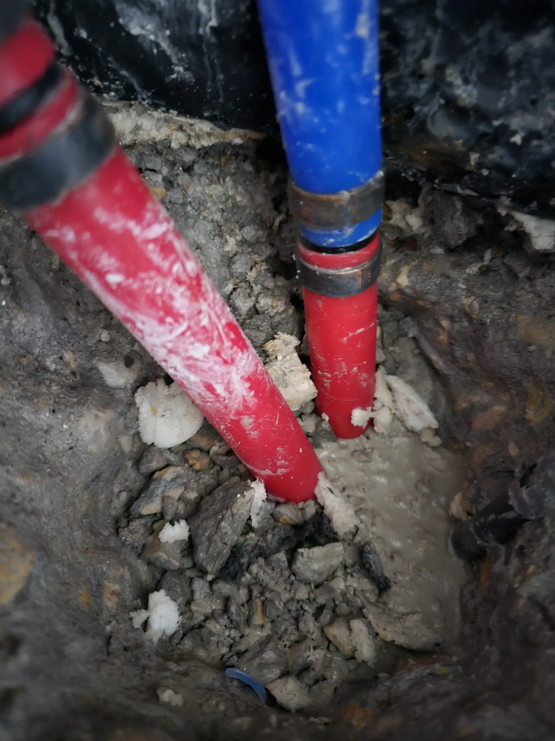 Moisture and leak diagnostic work with the wall opened, under work lights during leak diagnostics