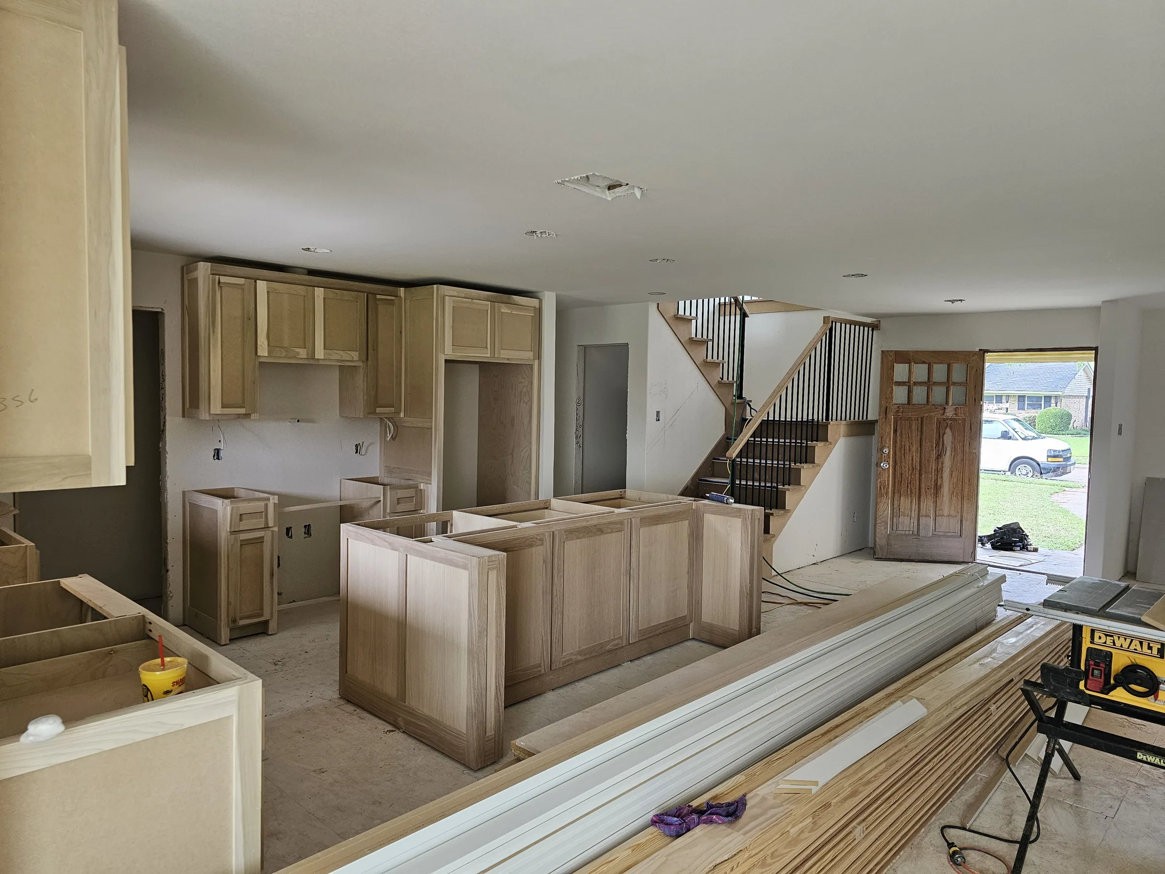 Interior of a custom home looking toward the windows, with the finishes in on the Mesquite remodel