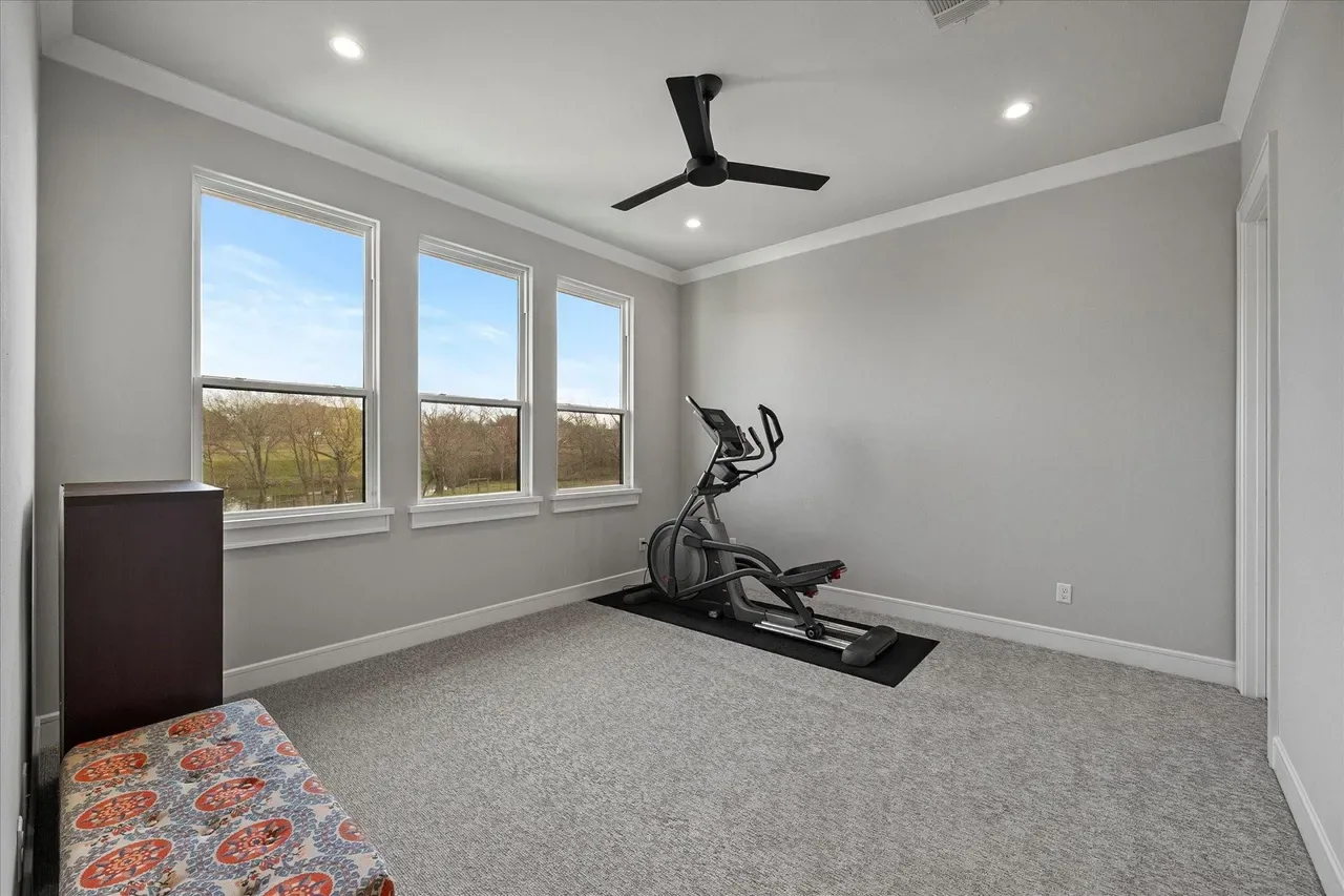 Interior of a custom home looking toward the windows at The Providence, Heath