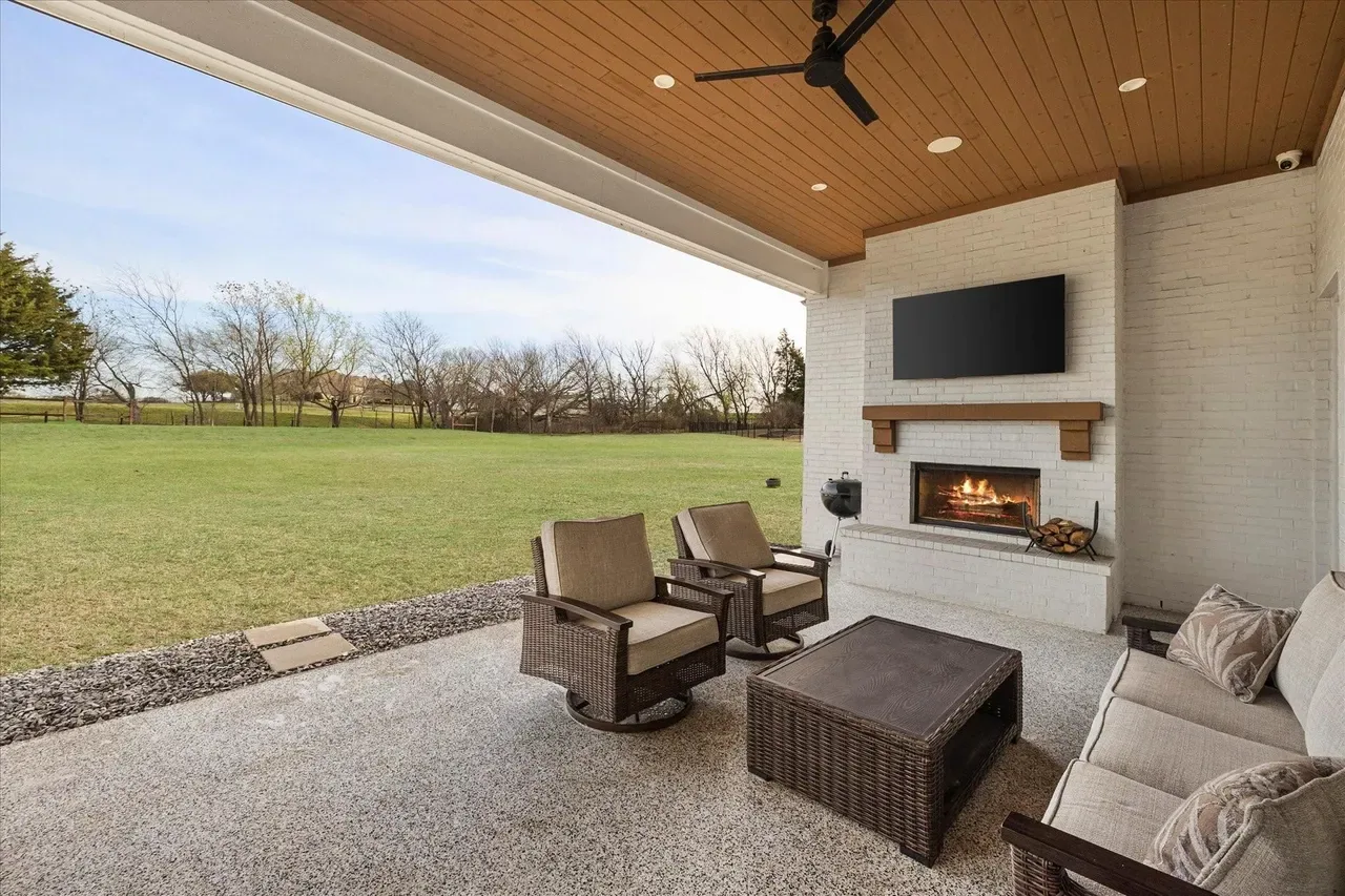 Living area of a custom home toward the fireplace at The Providence, Heath
