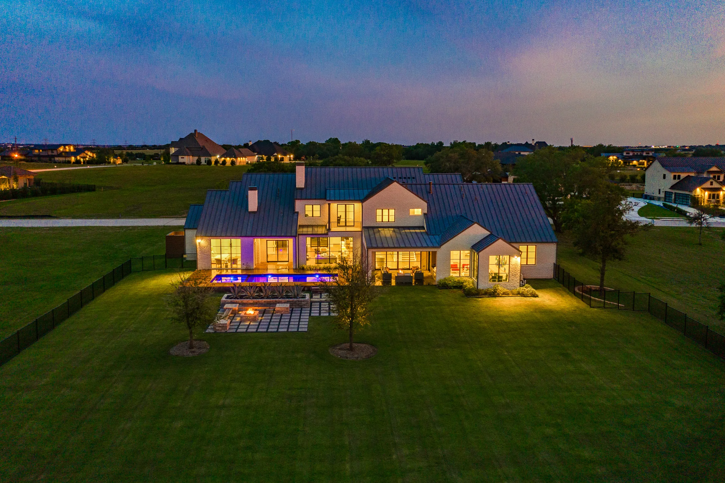 Aerial view of a custom home site from the north side, in daylight in Ridge Lakes of Heath