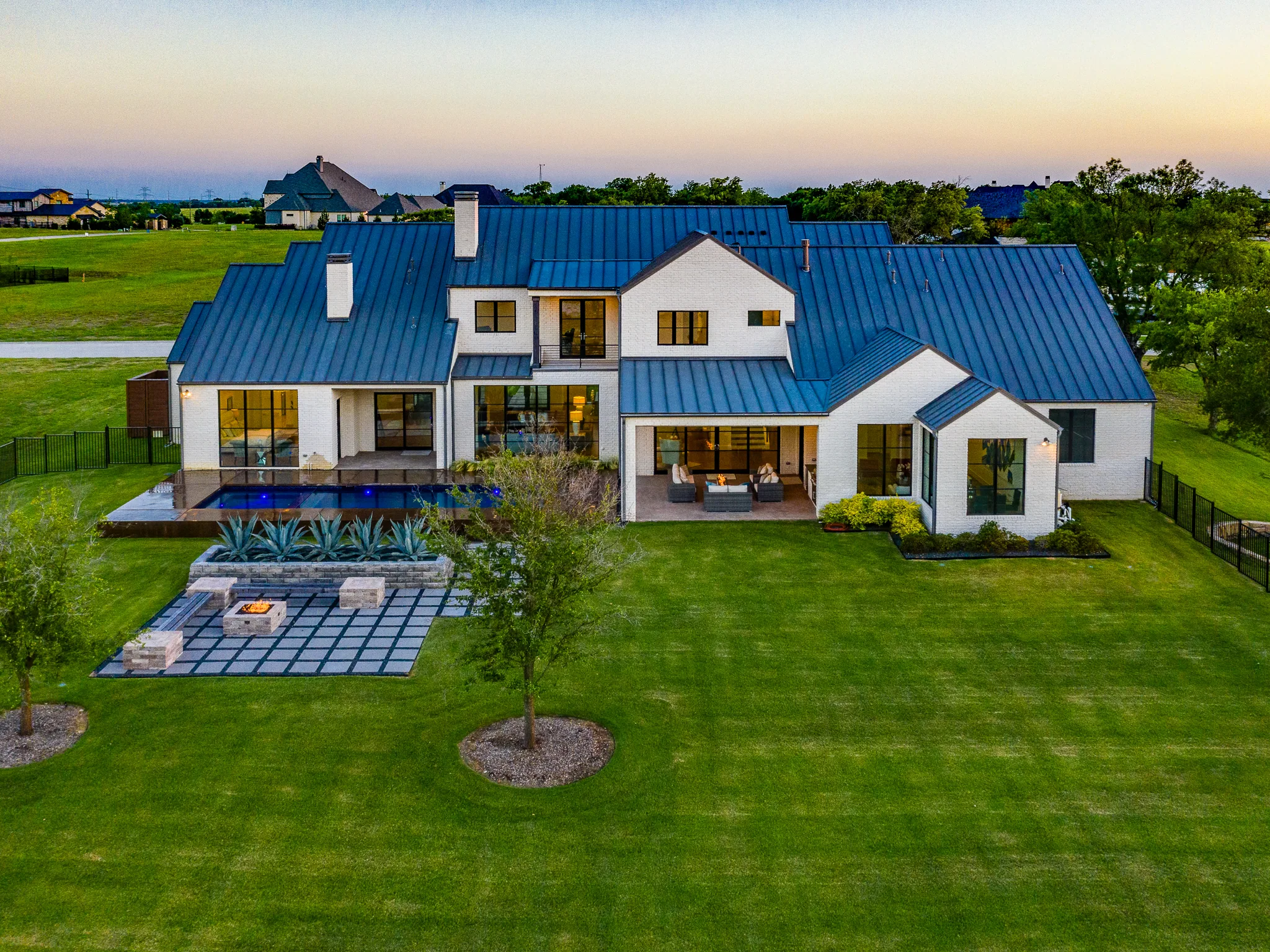 Aerial view of a custom home site across the lot, in daylight in Ridge Lakes of Heath