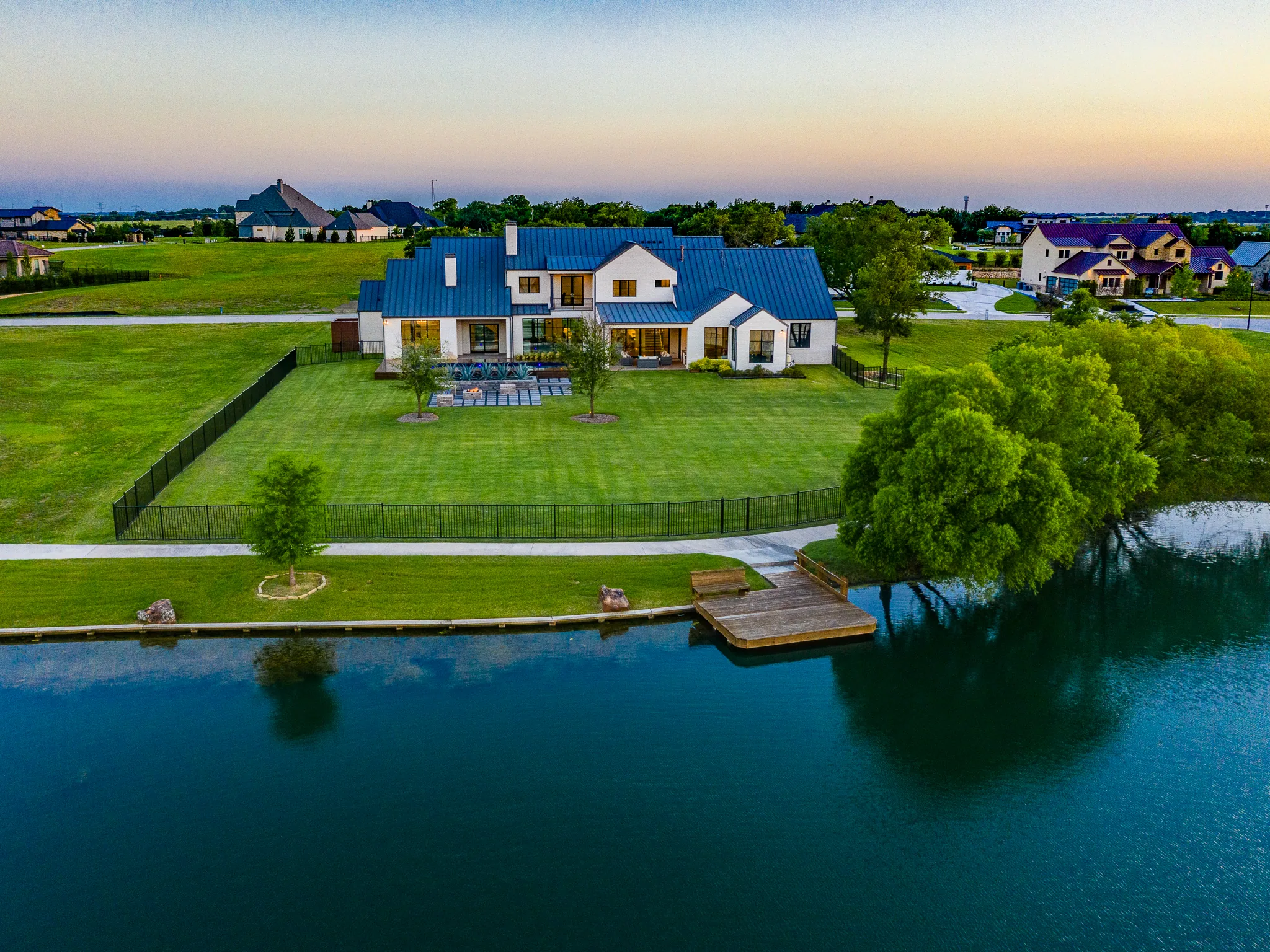Aerial view of a custom home site from above, with the finishes in in Ridge Lakes of Heath
