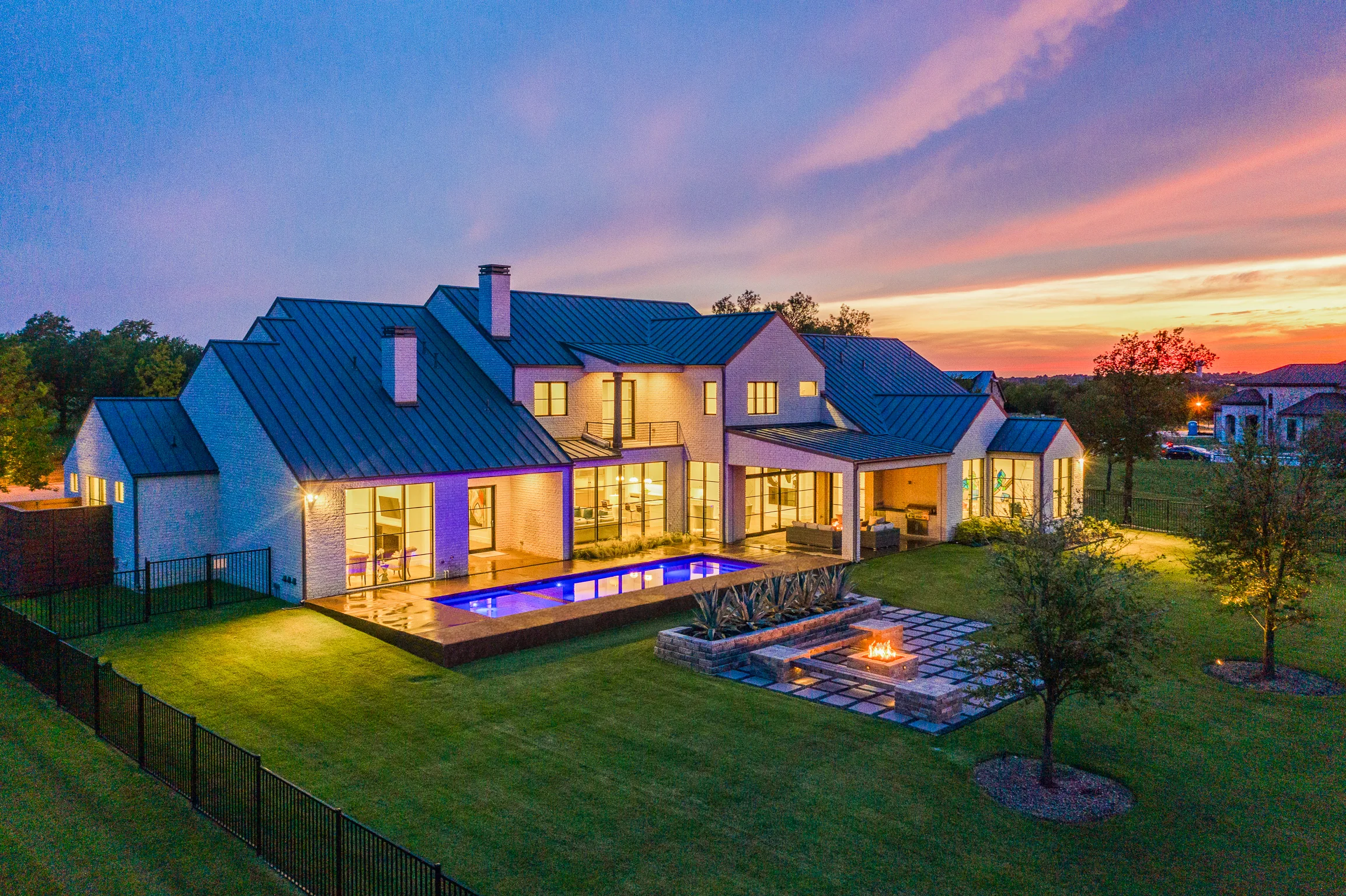 Aerial view of a custom home site over the roofline, with the finishes in in Ridge Lakes of Heath