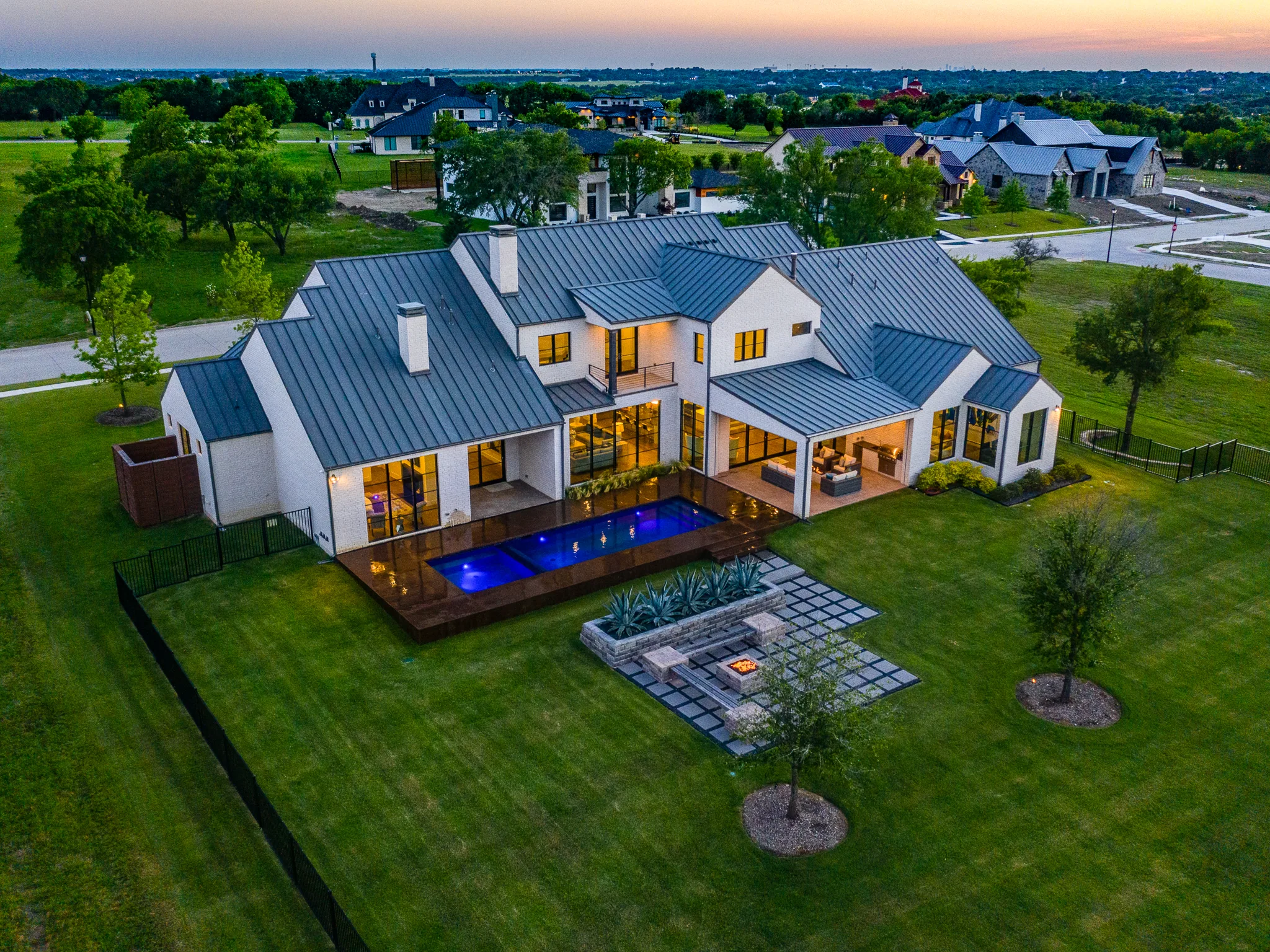 Aerial view of a custom home site from above, mid-build in Ridge Lakes of Heath