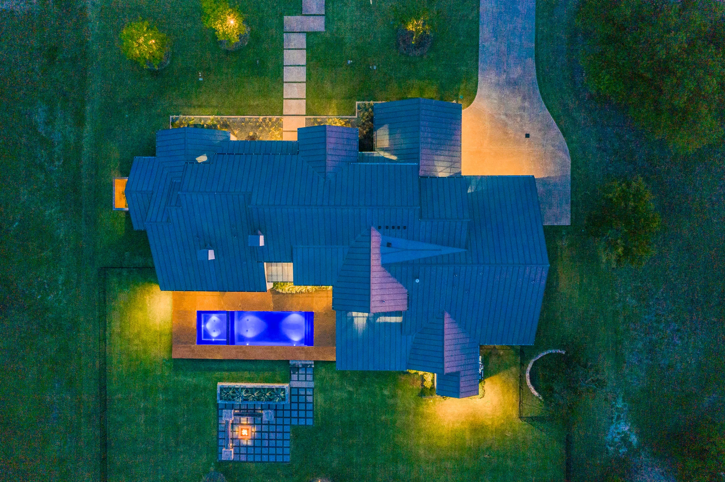 Aerial view of a custom home site from the north side, mid-build in Ridge Lakes of Heath