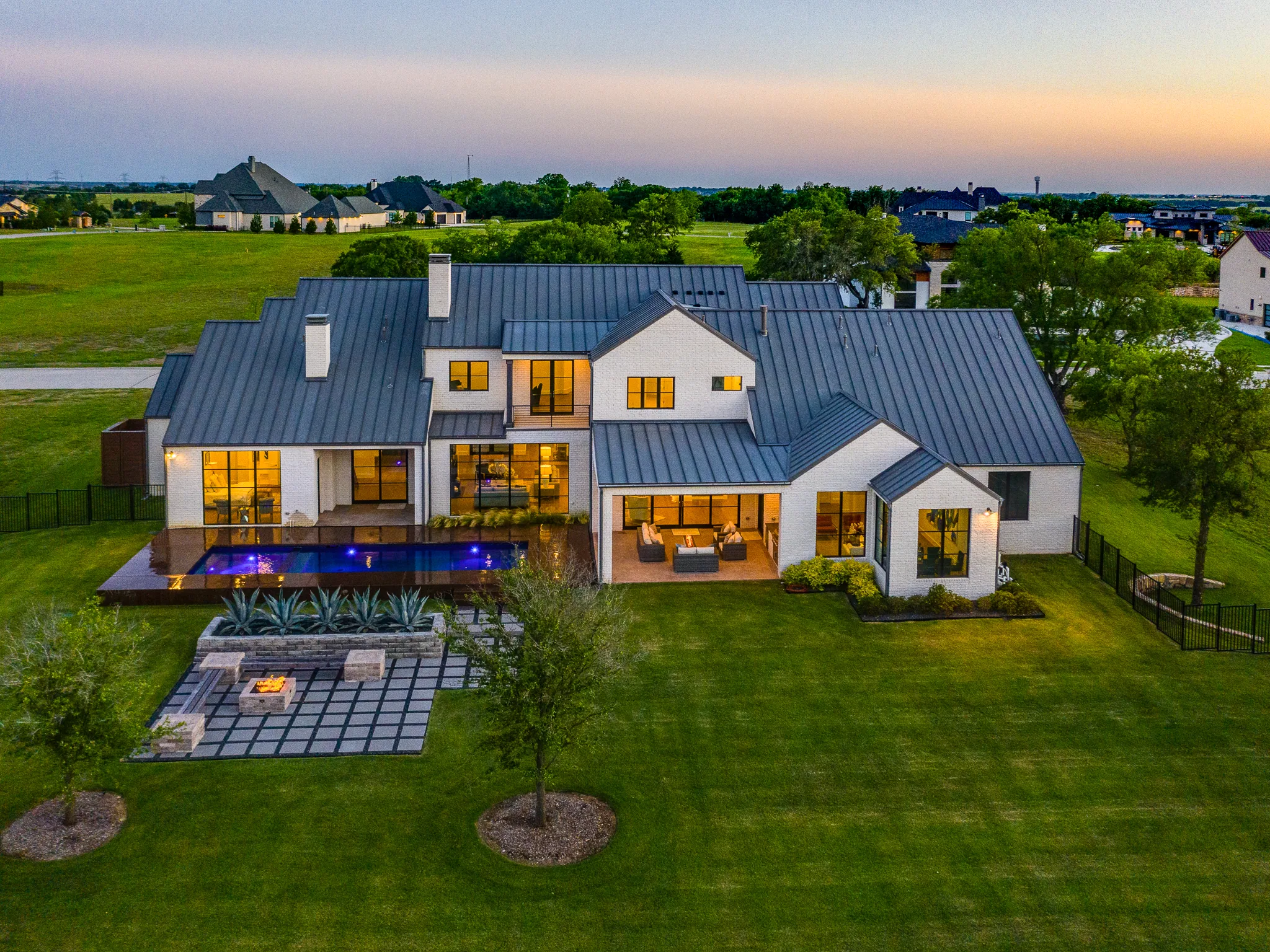 Aerial view of a custom home site looking down the drive, mid-build in Ridge Lakes of Heath