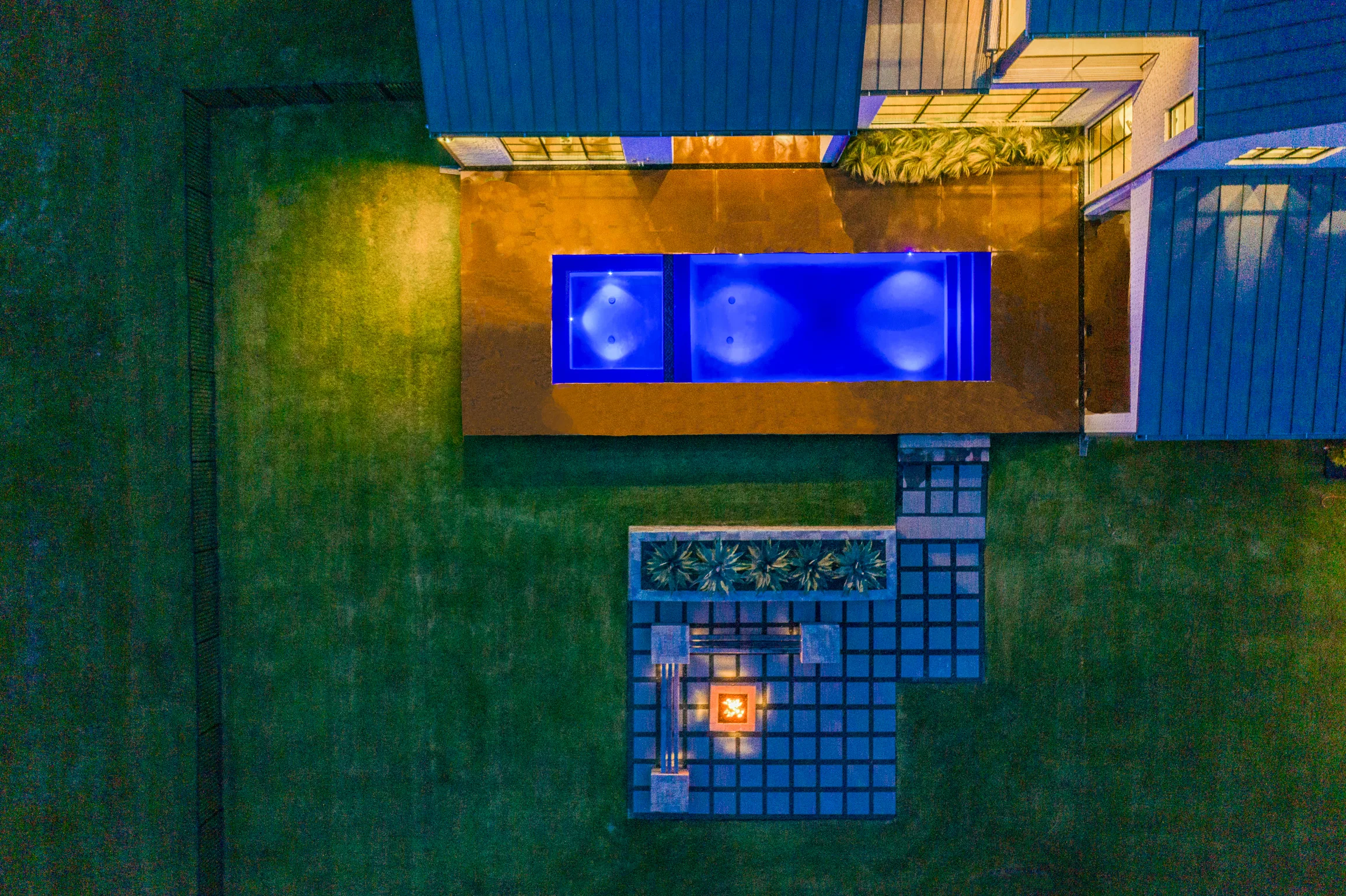Aerial view of a custom home site over the roofline, mid-build in Ridge Lakes of Heath