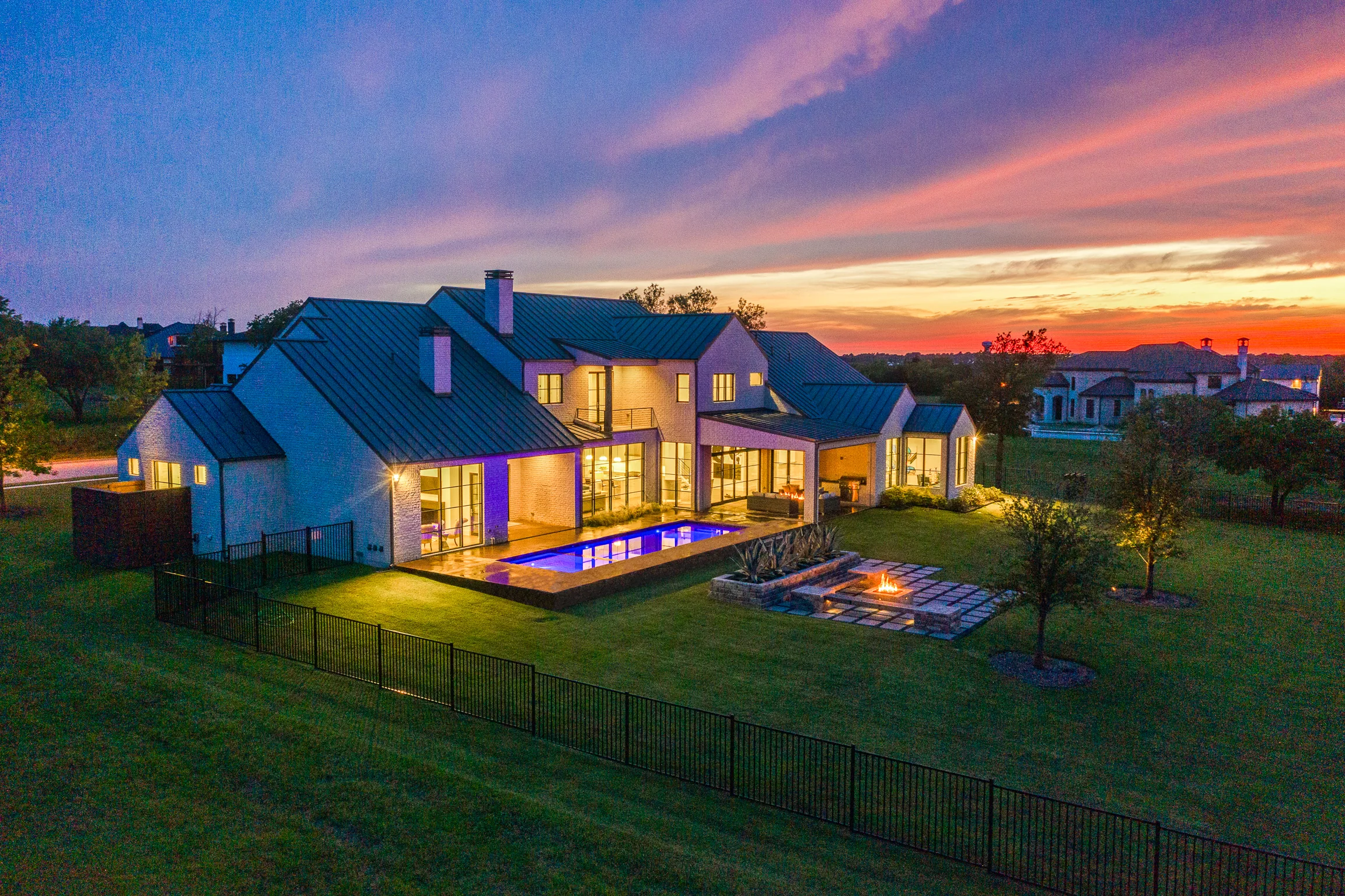 Aerial view of a custom home site from the rear of the property, mid-build in Ridge Lakes of Heath