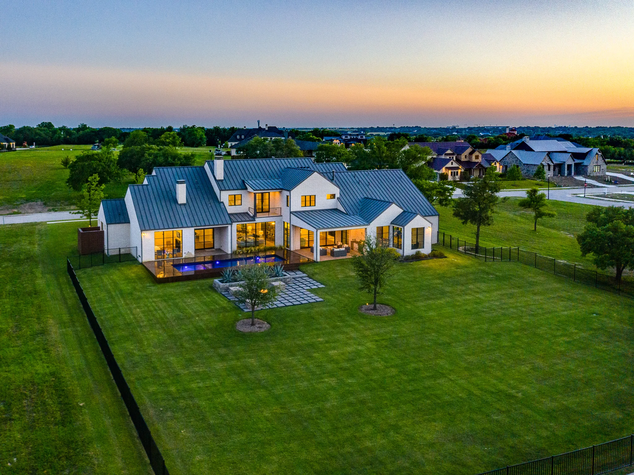 Aerial view of a custom home site from above, after completion in Ridge Lakes of Heath