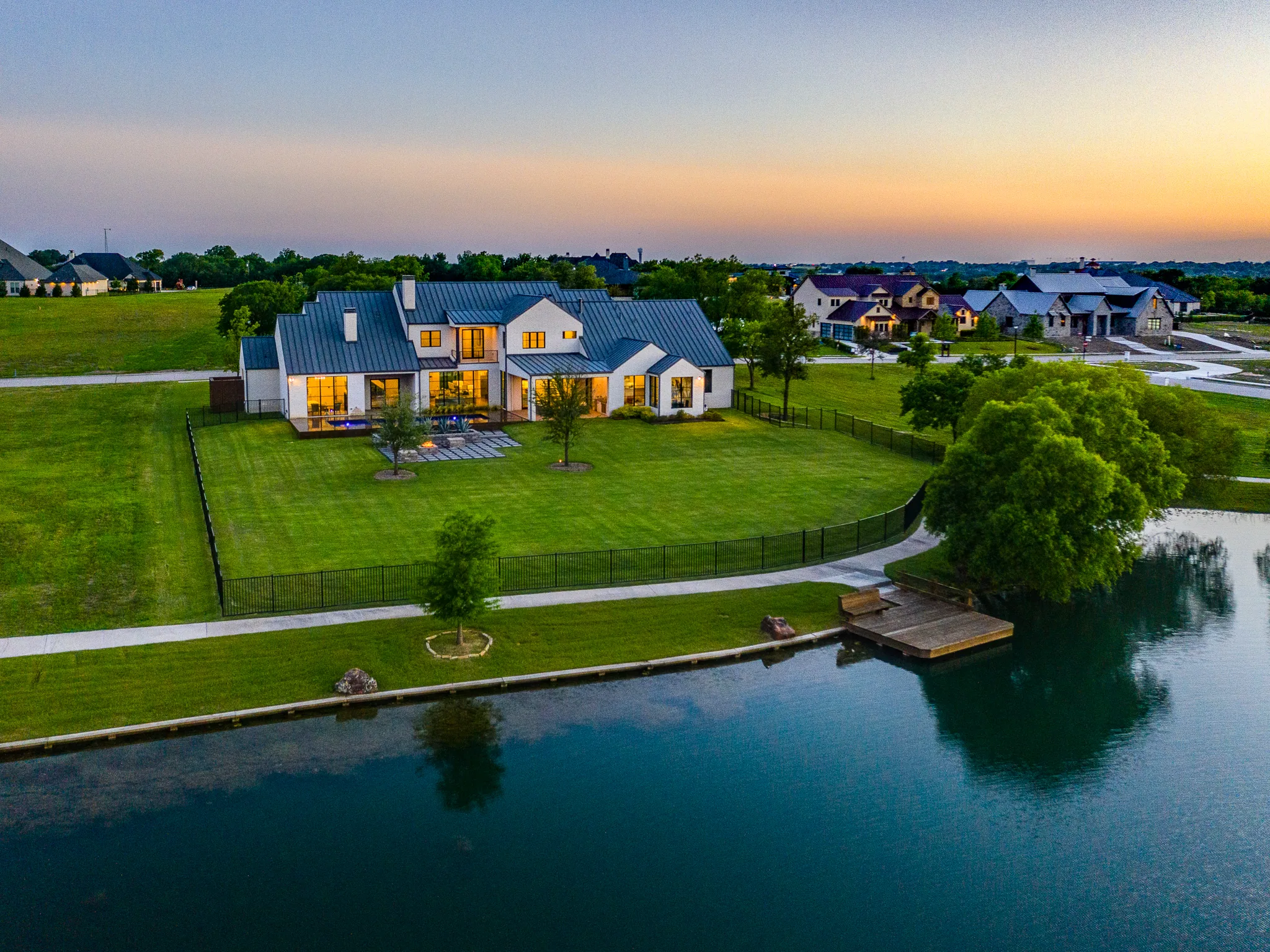 Aerial view of a custom home site from the north side, after completion in Ridge Lakes of Heath