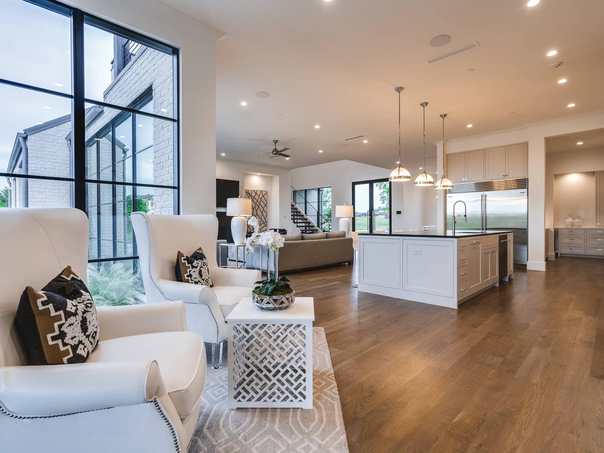 Exterior of a custom home from the driveway, with the finishes in in Ridge Lakes of Heath
