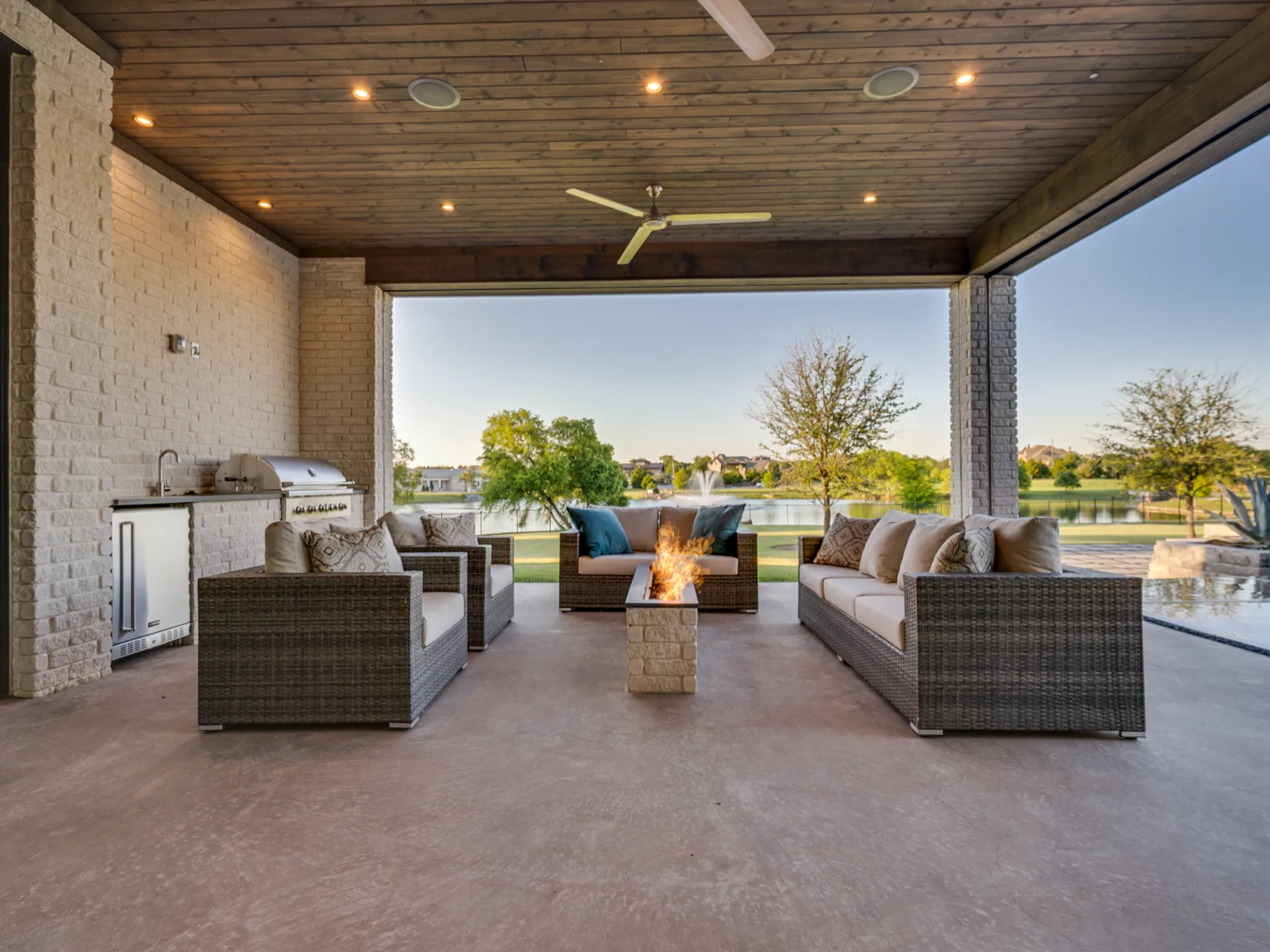 Exterior of a custom home from the street, under work lights in Ridge Lakes of Heath