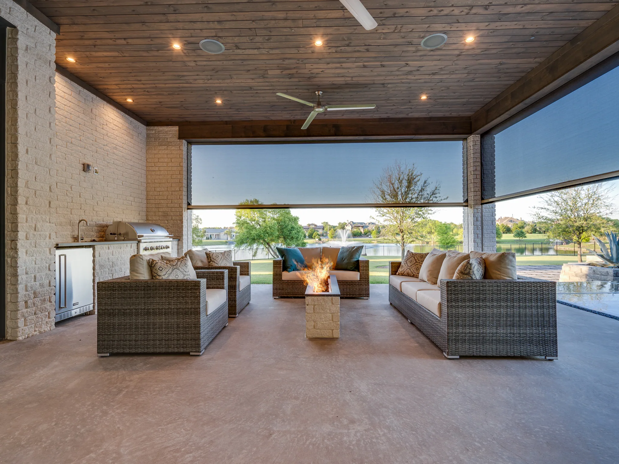 Exterior of a custom home from the driveway, under work lights in Ridge Lakes of Heath