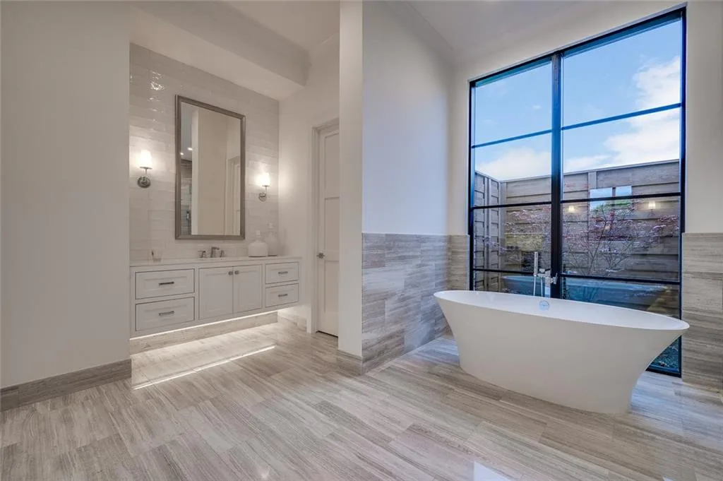Interior of a custom home toward the adjoining room, in daylight in Ridge Lakes of Heath