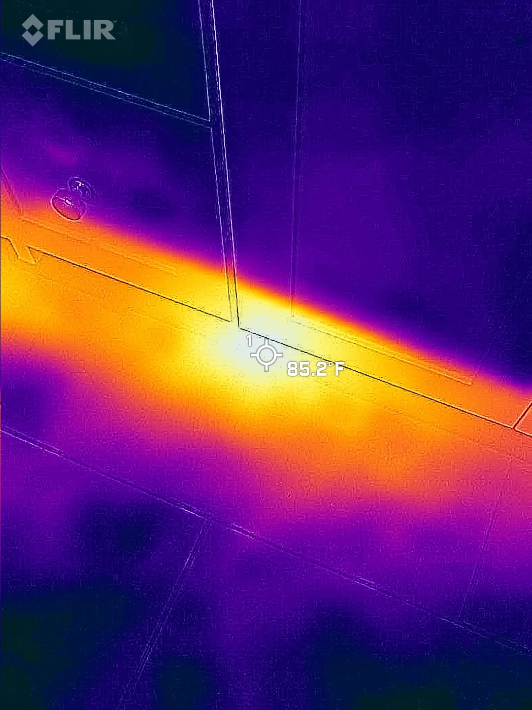 Thermal imaging scan during inspection at a ceiling joint, mid-build during a thermal inspection