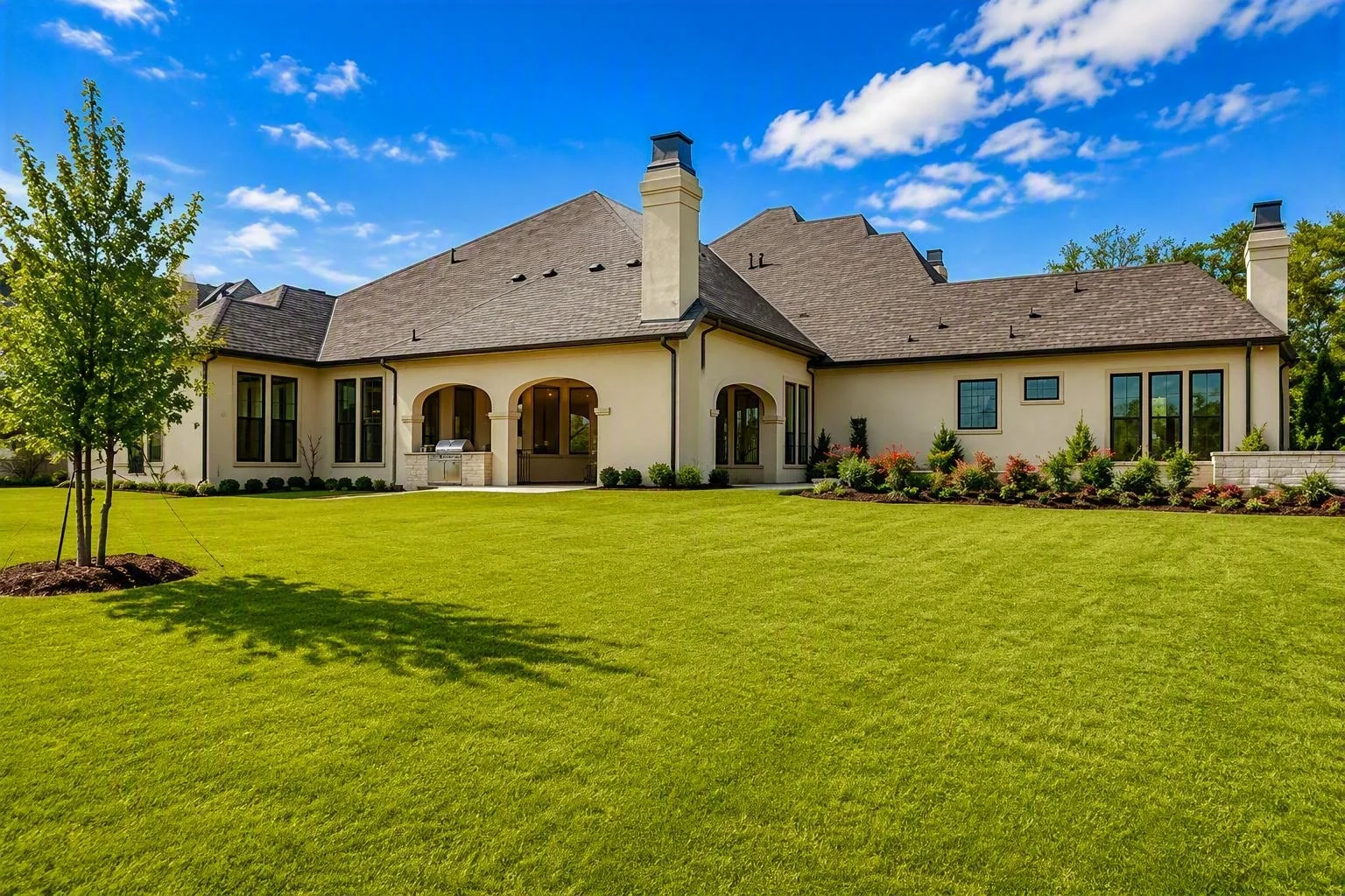 Exterior of a custom home from the rear yard at Wimberly Place, Allen